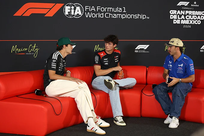 George Russell, Oliver Bearman and Pierre Gasly seated on a red sofa during the Thursday media session ahead of the 2026 Mexico City Formula 1 Grand Prix.